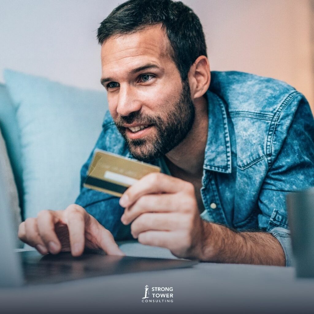 Man making online purchases with a debit card.