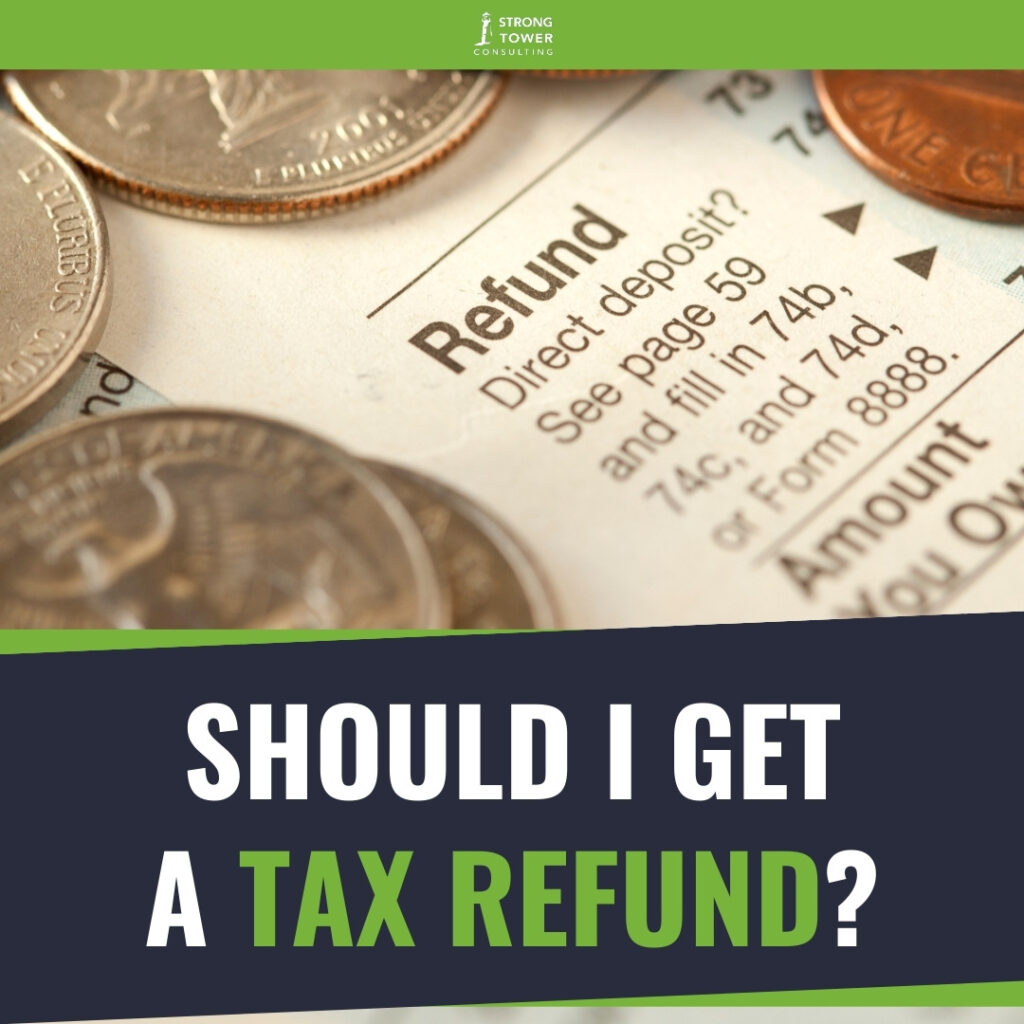 Refund tax form with change piles on top of the paper.