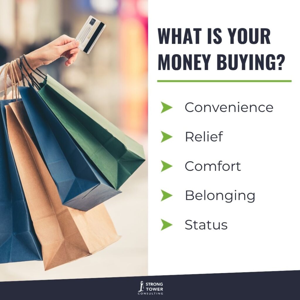 Woman holding a credit card and multiple shopping bags